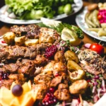 front-view-mix-kebab-skewers-with-potatoes-lemon-slices