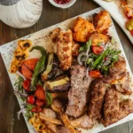 top-view-kebab-platter-with-ribs-chicken-lula-tikka-vegetables-kebab (1)